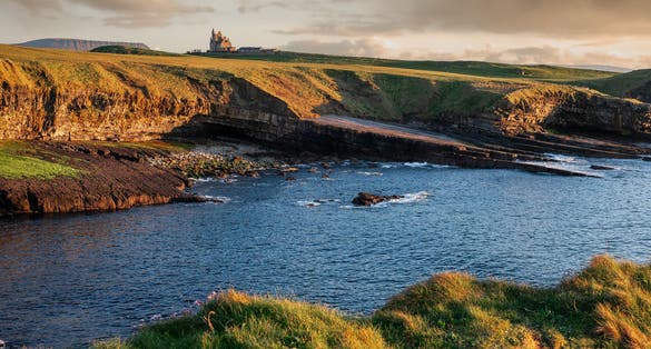 photo of view of Famous Gothic style castle Classiebawn in stunning nature setting in county Sligo, Ireland. Popular travel landmark. Irish landscape. Signature point of interest for tourist.