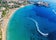 Photo of aerial panoramic beautiful view of Coral bay beach with jet ski and people having fun, Cyprus.