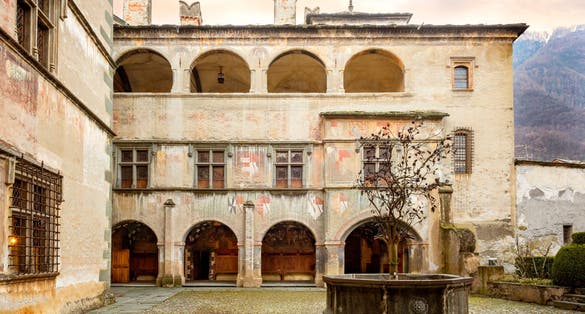 Issogne: Castle of Issogne. The courtyard with the pomegranate fountain. Val D'aosta, Italy. The castle of Issogne is one of the most famous castles of the Valle d'Aosta.