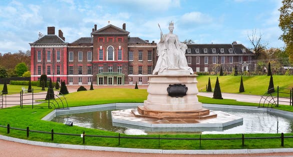 Photo of Kensington palace and Queen Victoria monument in London, UK.