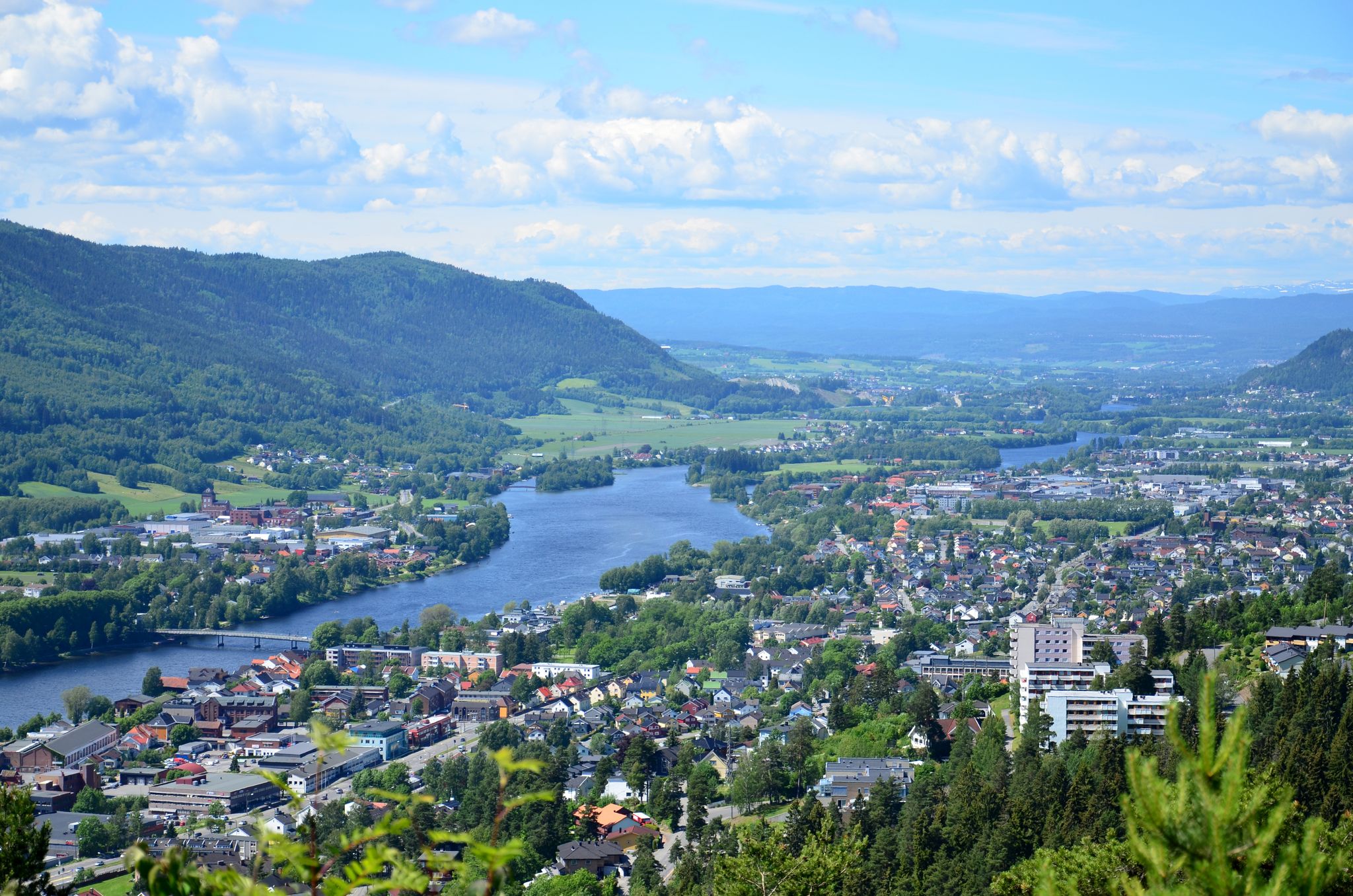 Beautiful landscape of the Drammen city with river and the mountains in Norway. Blue sky background.
