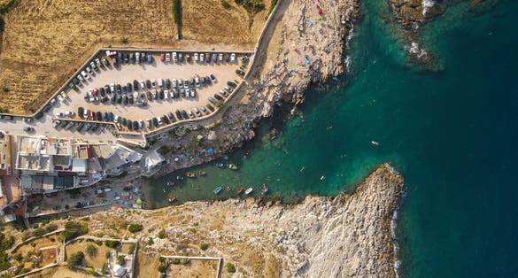 photo of  view ofAerial view of Cala Port'Alga near Torre Incina and Isola dell'Eremita in Polignano a Mare, in Puglia. Drone view of cliffs, coastline in Puglia and small island, near Monopoli, province of Bari.,Polignano a Mare Italy.