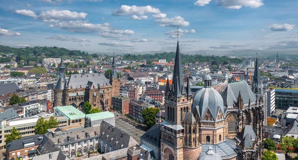 photo of view of Aachen (Germany) skyline panorama. Aerial view of Aachen Cathedral (Germany.: Aachener Dom) with Katschhof square and Town Hall (Rathaus) in background,Aachen 