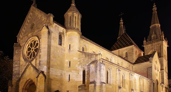 photo of night view of Collégiale de Neuchâtel in Neuchatel, Switzerland.