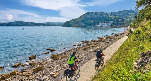 active senior couple on a mountain bike tour at Capodistria, Slovenian Mediterranen cost near Izola and Koper