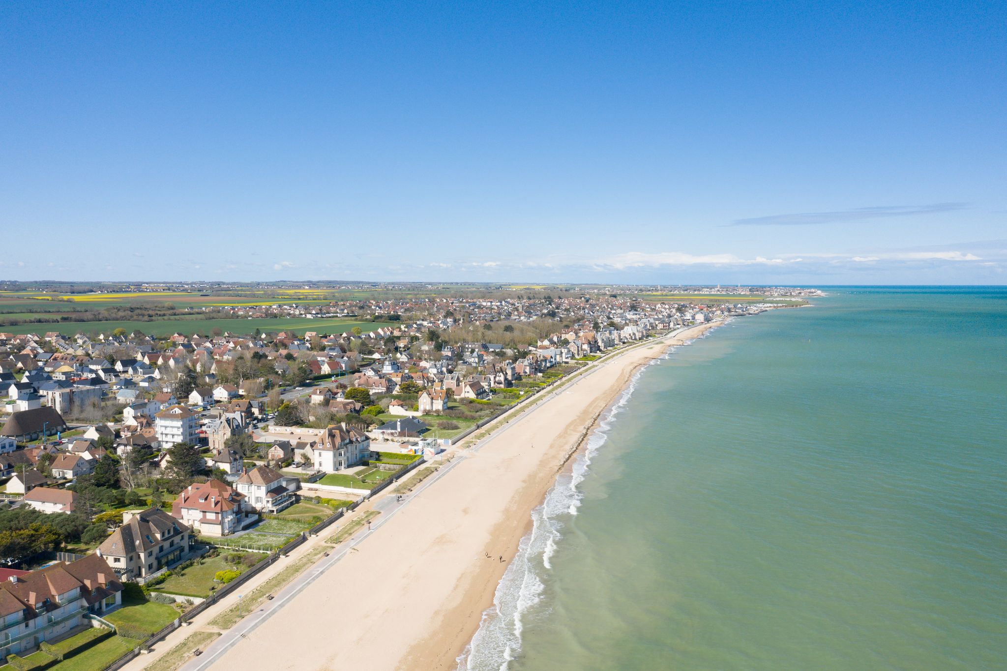 Photo of aerial view of the long sandy beach of Sword beach in Hermanville-sur-Mer towards Ouistreham ,France.