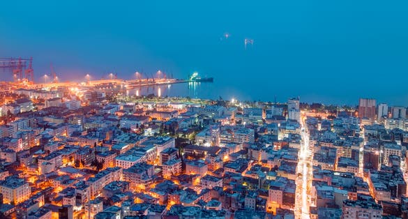 Photo of aerial view of Mersin city and port at at twilight blue hour, Turkey.