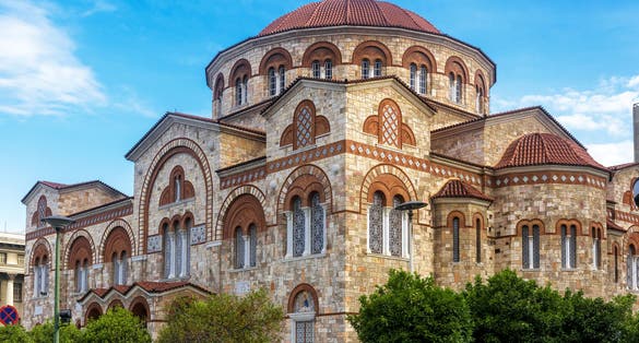 Photo of Church of Ieros Naos Agia Triada in Piraeus, Athens, Greece. It is tourist attraction of Piraeus. Monument of Greek Orthodox religion in Byzantine style. Concept of landmark and travel in Greece.