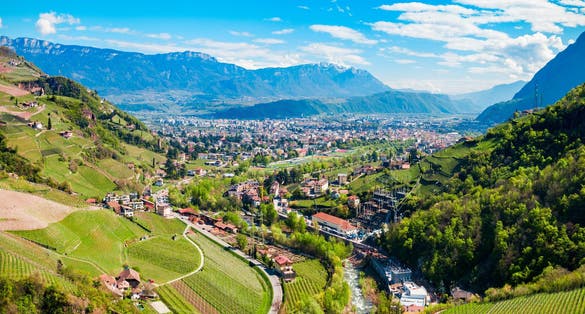 Bolzano and Dolomite mountains aerial panoramic view. Bolzano is the capital city of the South Tyrol province in northern Italy.