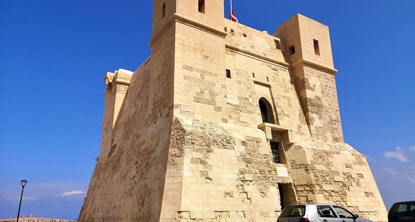 St. Paul's Bay, Malta - January 2nd 2023: A shadow on the Wignacourt Tower also known as St. Paul's Bay Tower was completed in 1610.