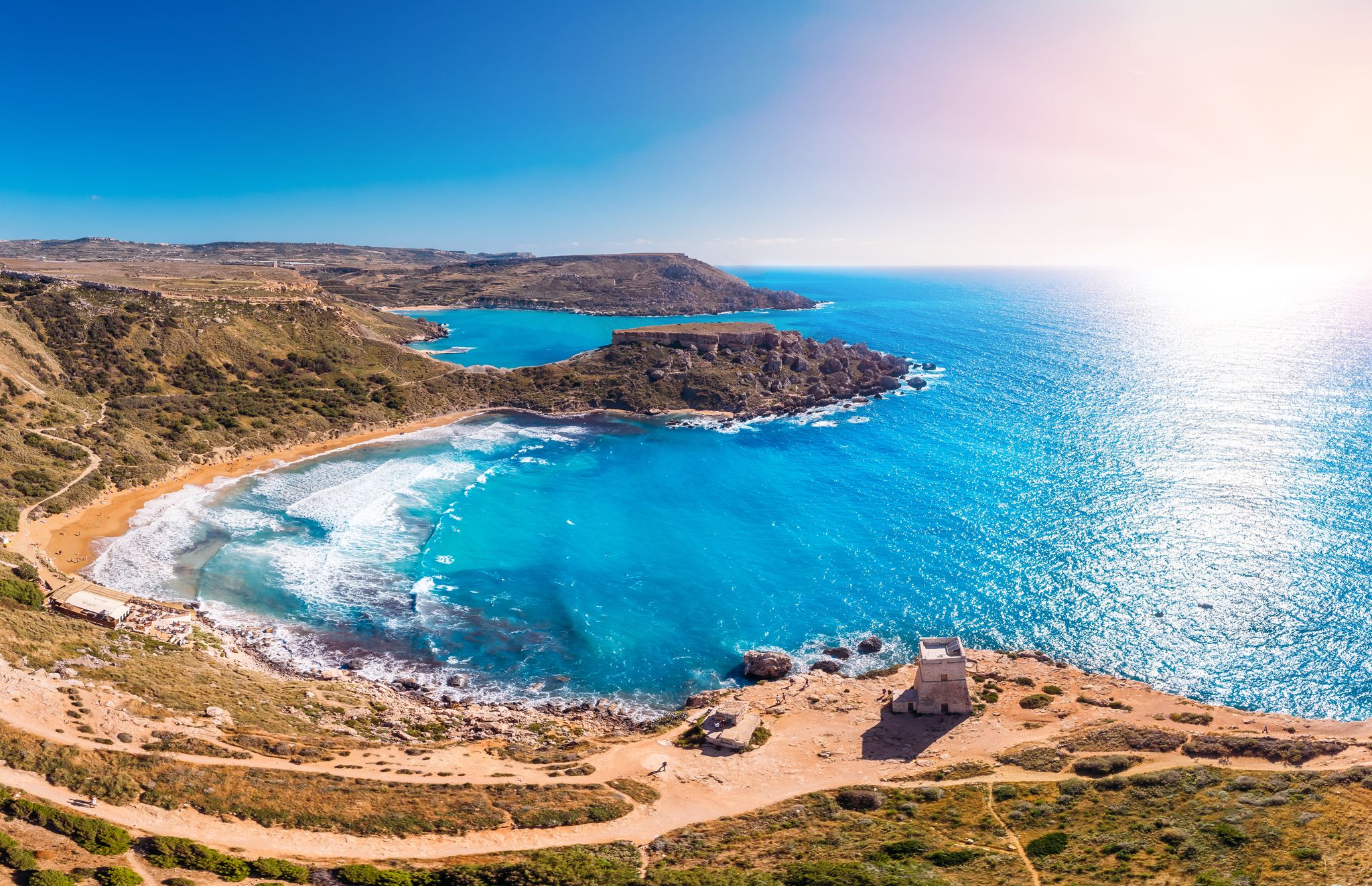 Photo of aerial view of Golden Bay summer tourist resort beach azure water sea, Malta.