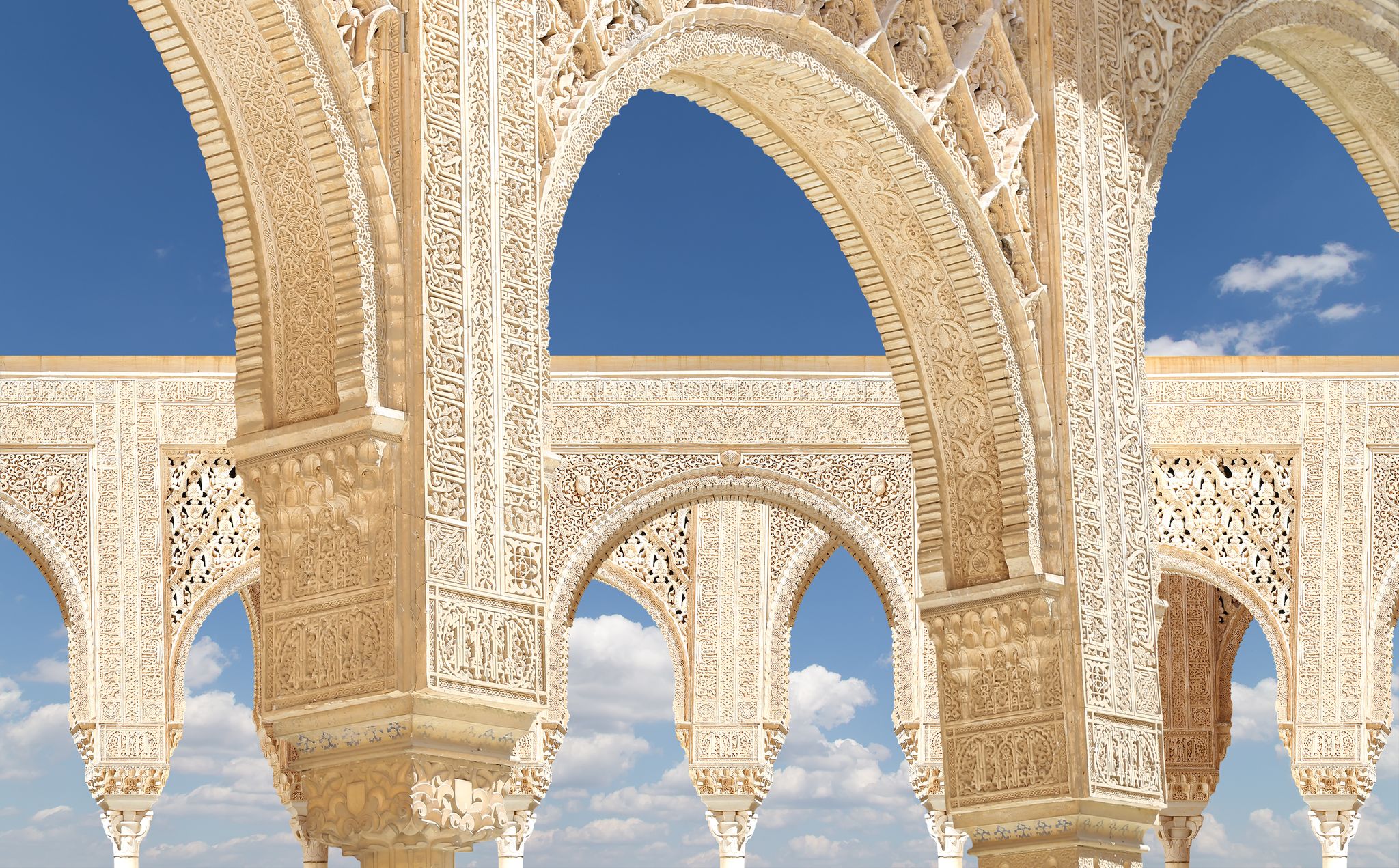 Photo of Arches in Islamic (Moorish) style in Alhambra, Granada, Spain .