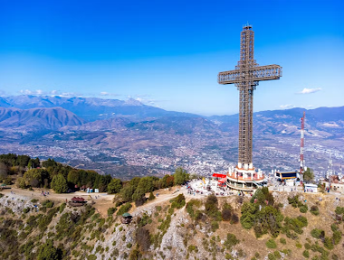 The Millennium Cross stands tall on Mount Vodno in Skopje, North Macedonia, overlooking the city and mountains..png