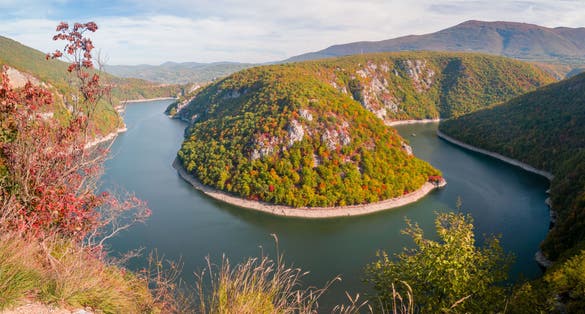 PHOTO OF VIEW OF An accumulation lake on the Vrbas River west of Banja Luka, in a canyon between the Manjača and Čemernica mountains. Beautiful view of nature with autumn colors. - Image