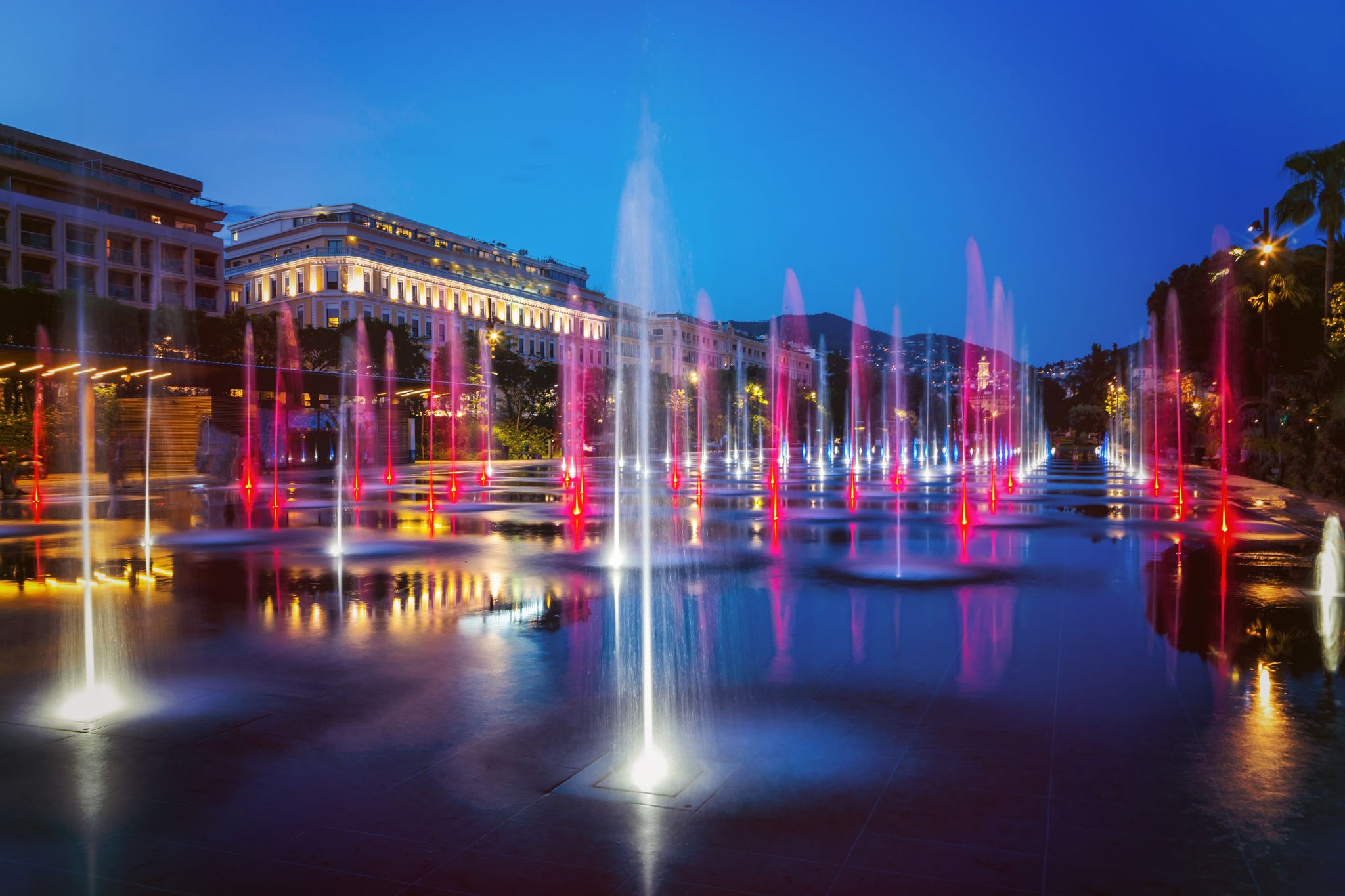 photo of the flat fountain in Promenade du Paillon Park at night in Nice, France.