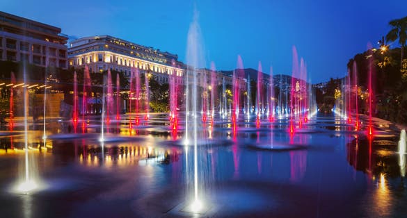 photo of the flat fountain in Promenade du Paillon Park at night in Nice, France.