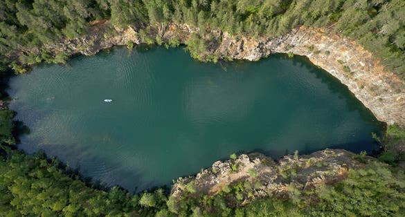  Photo of an old quarry and blue lagoon at Kangaslammi in Varkaus, Finland.