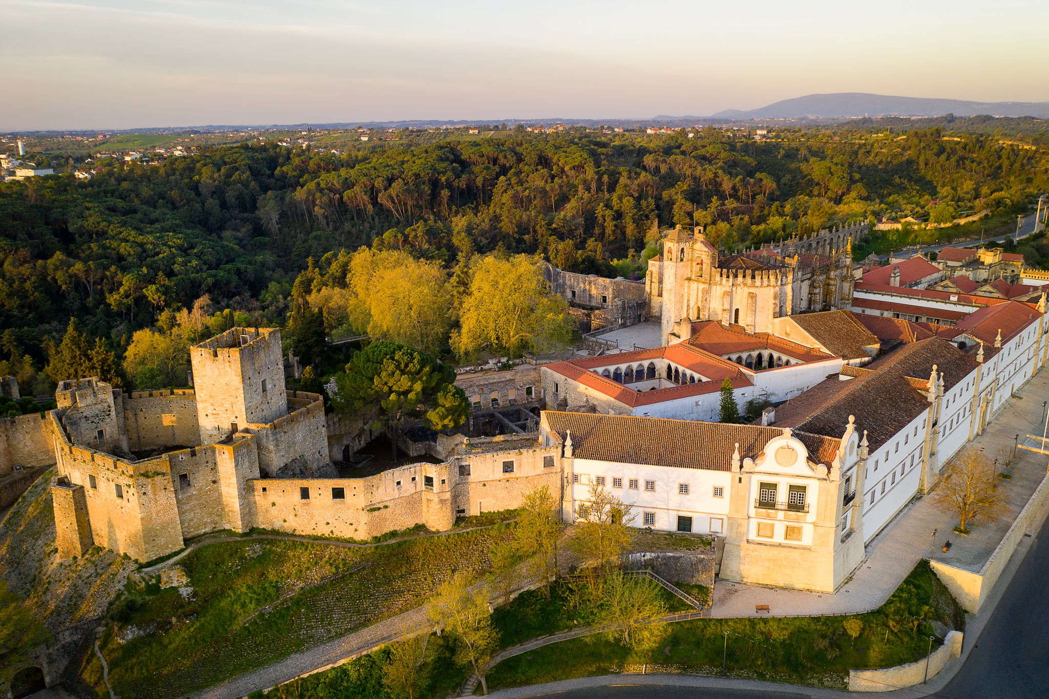 Aerial drone view of Convento de cristo christ convent in Tomar at sunrise, Portugal.