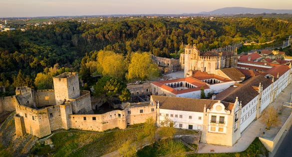 Aerial drone view of Convento de cristo christ convent in Tomar at sunrise, Portugal.