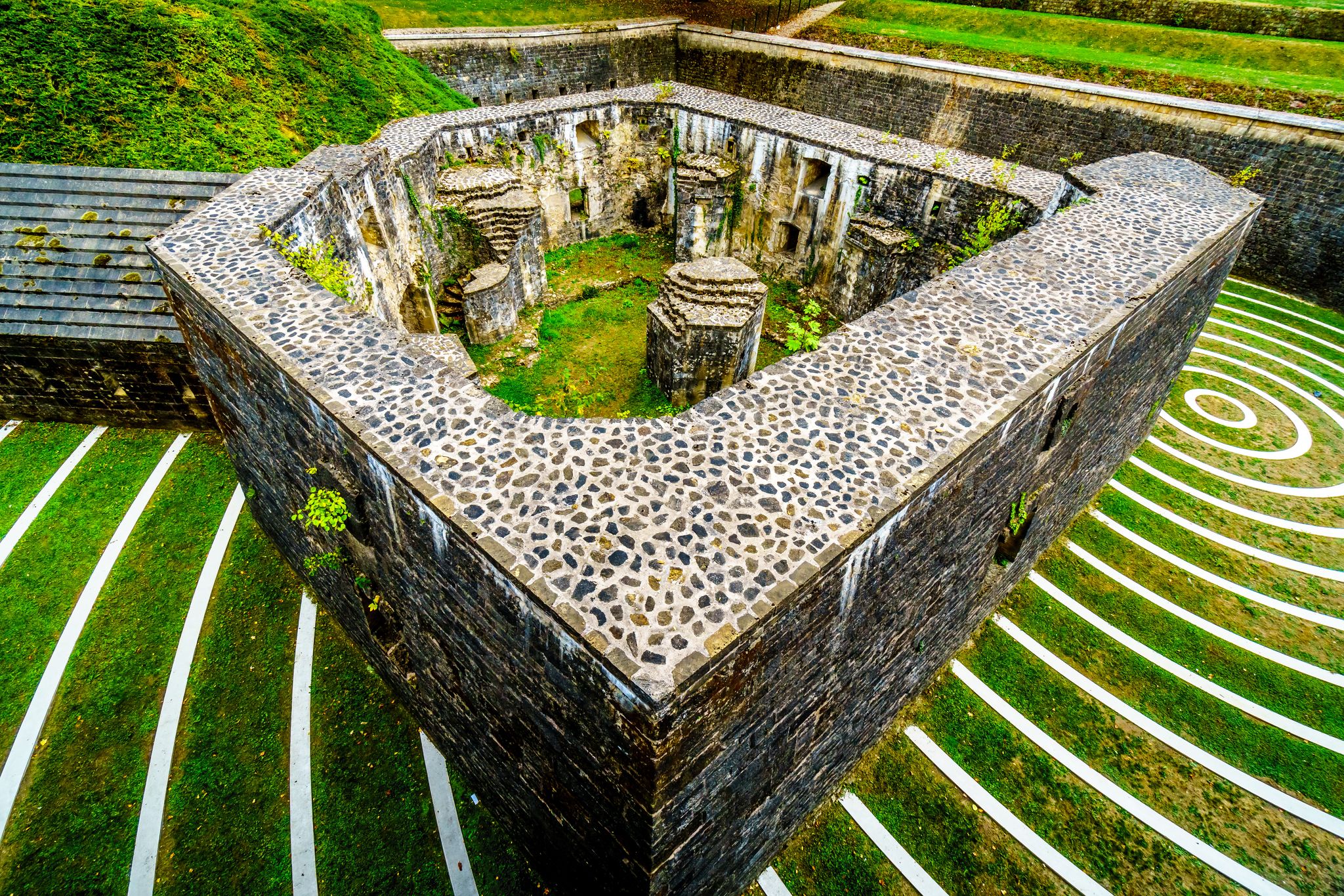 photo of concentric circles in the lambert redoubt ruins. The ruins are part of a seventeenth-century fort in a municipal park in the city of Luxembourg.