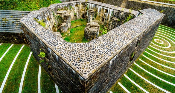 photo of concentric circles in the lambert redoubt ruins. The ruins are part of a seventeenth-century fort in a municipal park in the city of Luxembourg.
