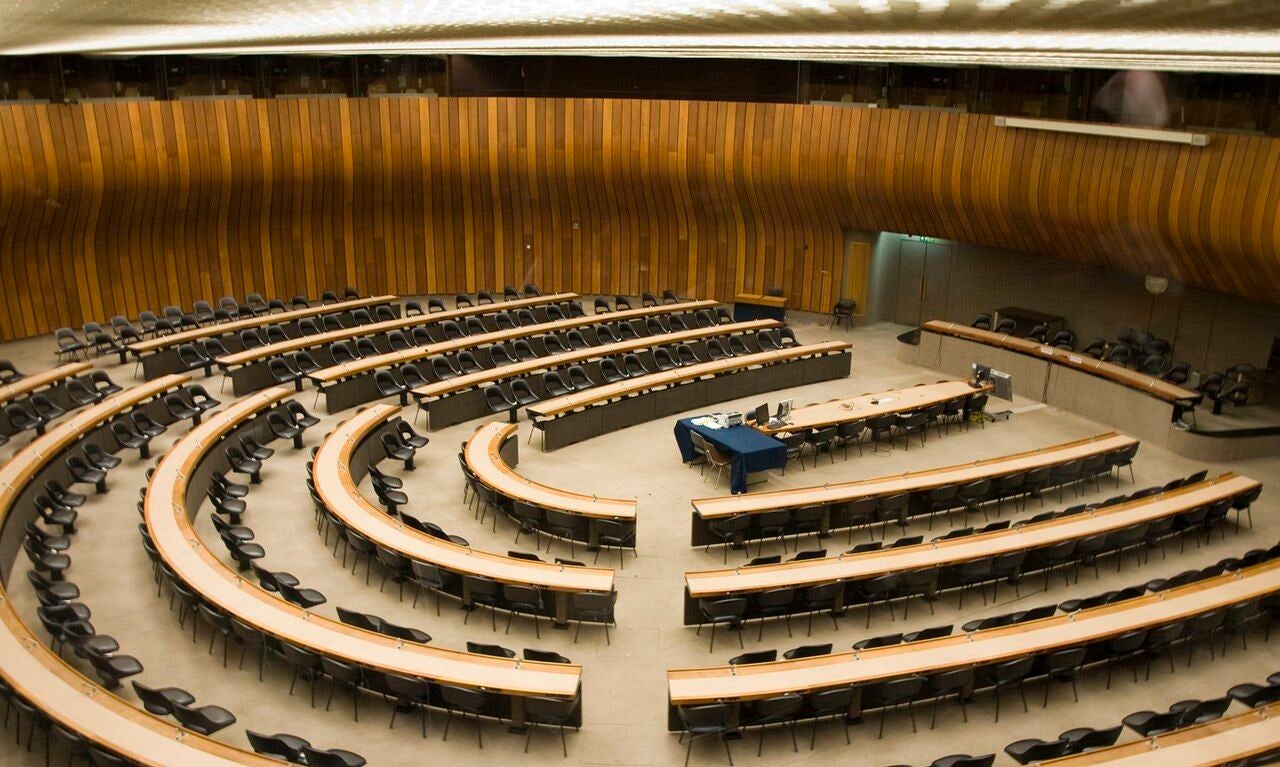 photo of a conference room in the Palace of Nations in Geneva, Switzerland.