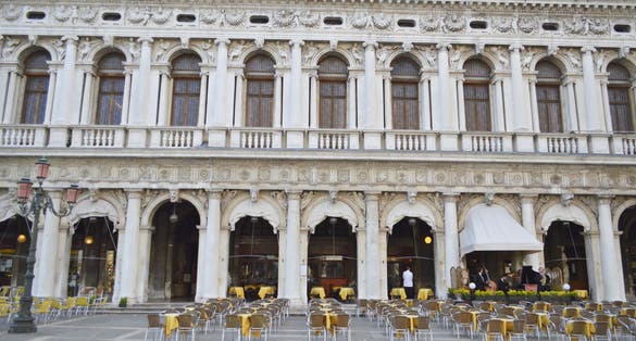 photo of Tourist site of St Mark's Square in Venice, Italy, tall St Mark's tower, the San Marco Basilica cathedral and other baroque and gothic sites in the most famous piazza in the city of Venezia.