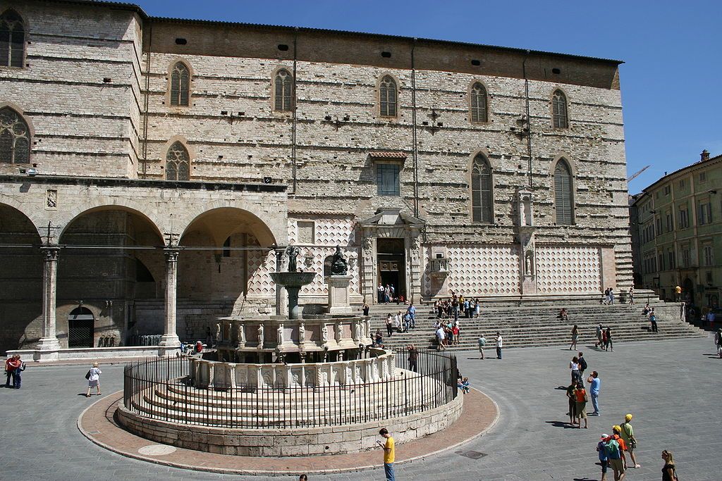 photo of view  of The cathedral's south wall with the Loggia di Braccio on the left and the Fontana Maggiore in the foreground, Perugia, Italy.