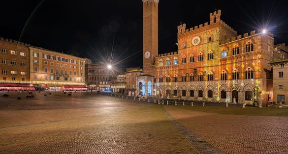 photo of view of Arezzo, Tuscany, Italy: night view of the main square Piazza Grande, Arezzo, Italy.