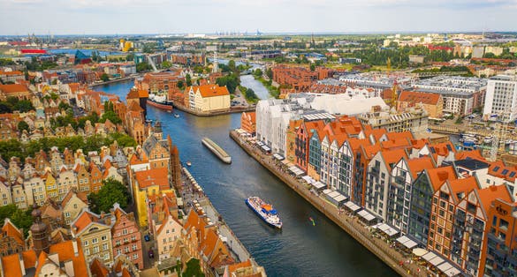 Photo of beautiful panoramic aerial view to old city Gdansk, Motlawa river, Poland.