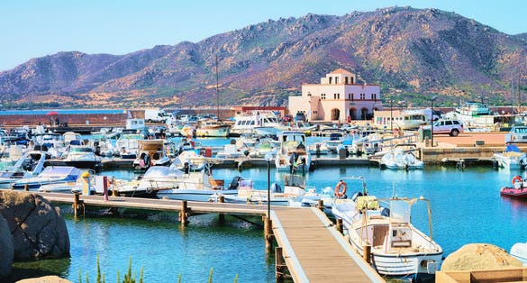 Port with ships and yachts, Villasimius, Cagliari, South Sardinia in Italy.
