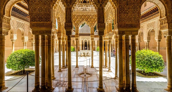Photo of court of the Lions Nasrid Palaces of Alhambra palace complex, Granada, Spain.