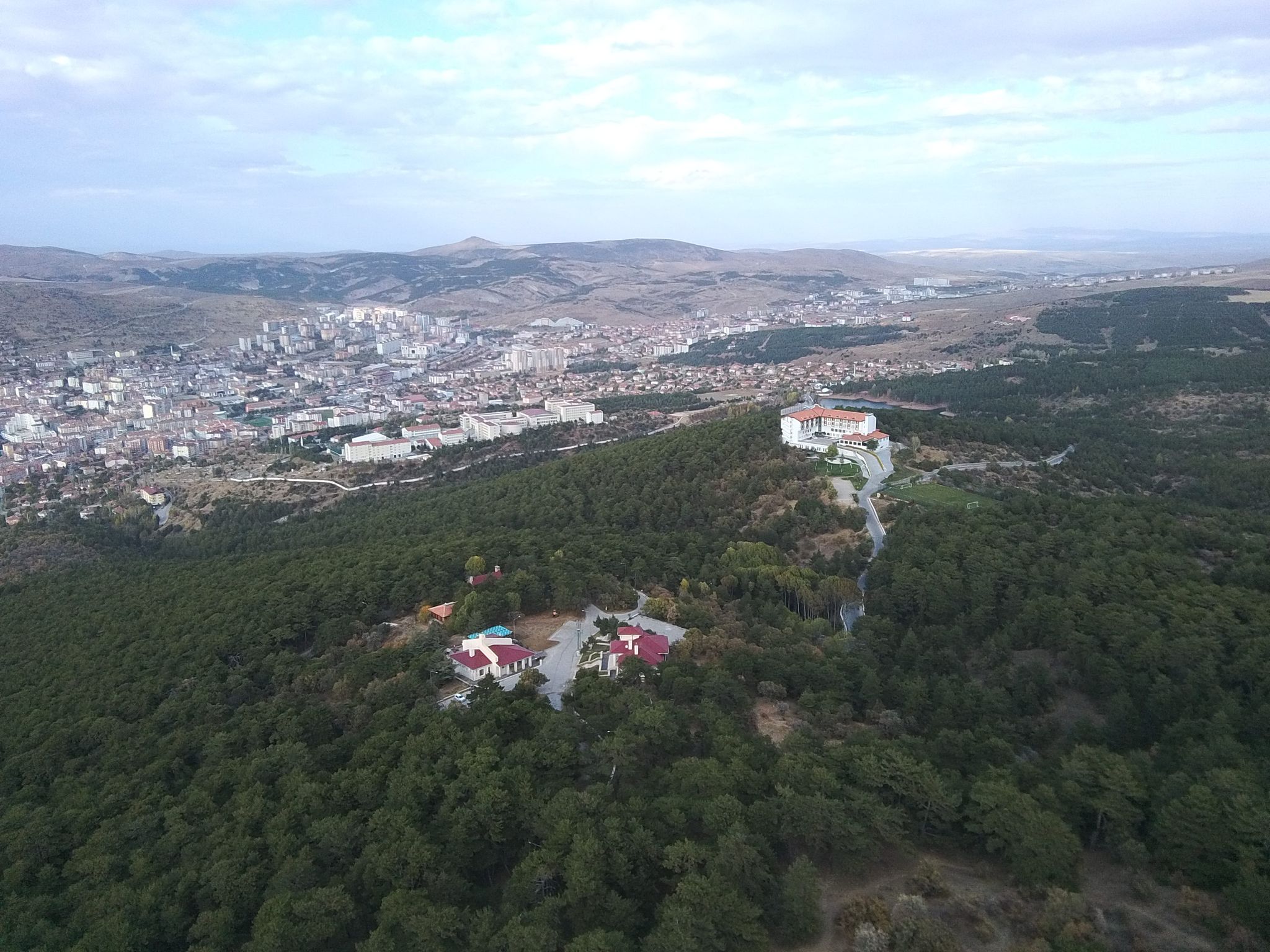 photo of foggy day in aerial view of Yozgat Pine Grove National Park in Turkey.