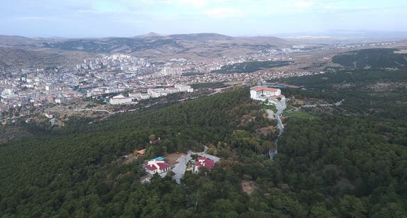 photo of foggy day in aerial view of Yozgat Pine Grove National Park in Turkey.