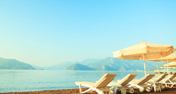 Photo of chaise lounge on the beautiful sandy beach in Marmaris, Turkey.