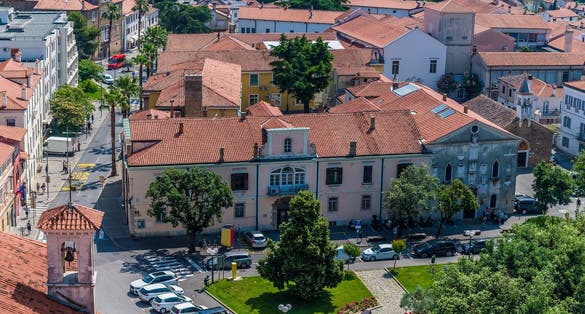 A view east from the clock tower above Tito Square over the rooftops of Koper, Slovenia in summertime