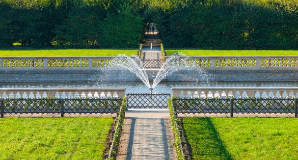Photo of Kromeriz Flower Garden in french style with green lawns and fountain, Czech Republic.