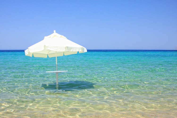 Photo of Neos Marmaras beautiful beach with blue sky, Halkidiki, Greece.