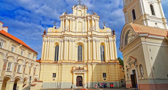 Church of Saint John and its belfry at the Grand courtyard of Vilnius University, Vilnius, Lithuania. People on the background.