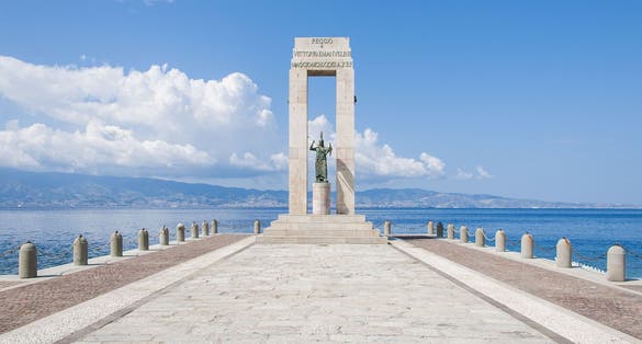 Athena statue in front of the sea, Arena dello Stretto in Reggio Calabria, Italy. The ancient goddess of philosophy and wisdom.