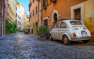 Aerial panoramic cityscape of Rome, Italy, Europe. Roma is the capital of Italy. Cityscape of Rome in summer. Rome roofs view with ancient architecture in Italy. 
