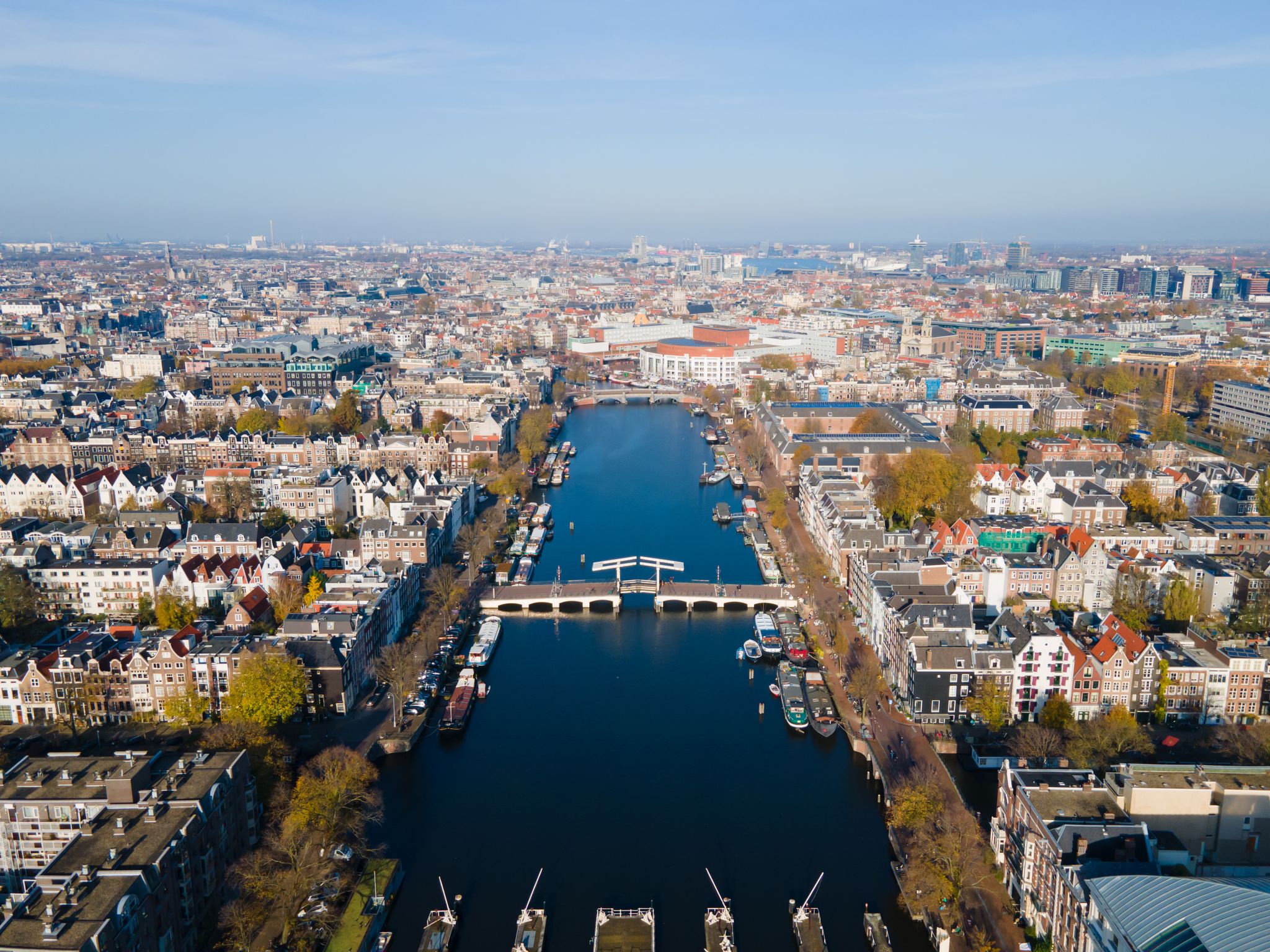 photo of Amsterdam, The Netherlands, 7th November 2020 aerial view of the Magere Brug Amsterdam And the river Amstel, City hall and Hermitage autumn.