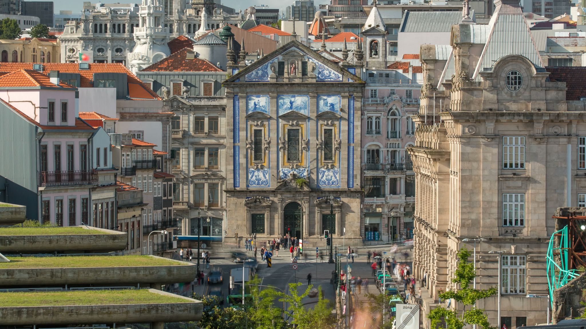 View of the Almeida Garret Square with the Sao Bento railway station and Congregados Church at the back timelapse, Porto, Portugal.