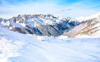 Photo of The winter view on the montains and ski lift station in French Alps near Chamonix Mont-Blanc.
