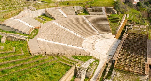 Aerial view of the ancient remains of a Roman theater. The archaeological site is located in Tivoli, near Rome, Italy.