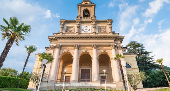 Photo of historic center of a Swiss city, Mendrisio with the main church of Saints Cosmas and Damian (Santi Cosma e Damiano), Canton Ticino, Switzerland.
