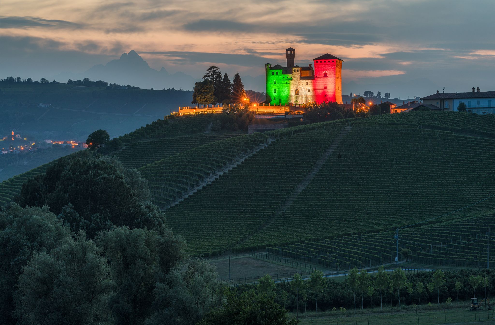 The beautiful Grinzane Castle illuminated in the evening. Langhe region of Piedmont, Cuneo, northern Italy.