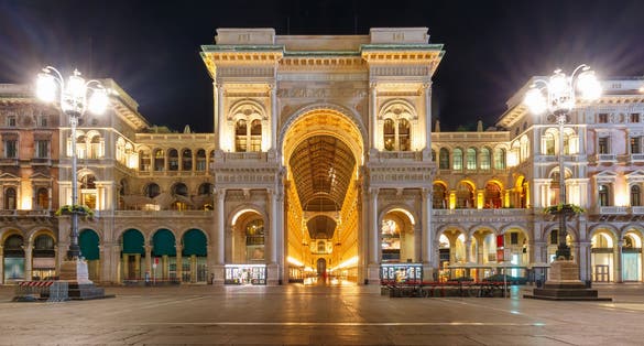 photo of one of the world's oldest shopping malls galleria vittorio emanuele II at night in milan, lombardia, Italy.