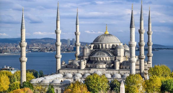 Aerial shot of Blue Mosque (Sultan Ahmed Mosque) surrounded by trees in Istanbul's Old City - Sultanahmet, Istanbul, Turkey.