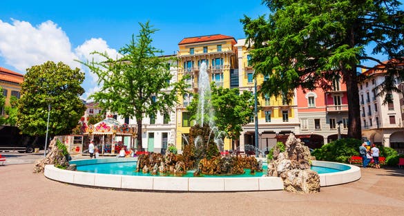 Photo of fountain at the Piazza Alessandro Manzoni, the main square in Lugano city in canton of Ticino, Switzerland.